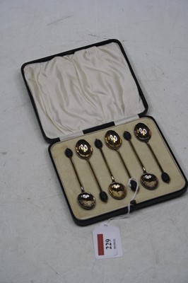 Lot 229 - A cased set of six silver and enamel backed...