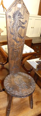 Lot 1376 - A stained beech and line carved spinning seat
