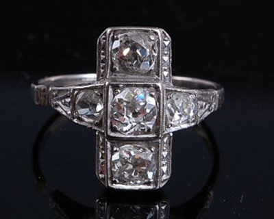 Lot 2160 - A white metal Art Deco diamond panel ring,...