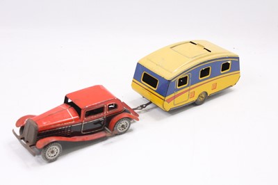 Lot 870 - Mettoy tinplate clockwork saloon car with...