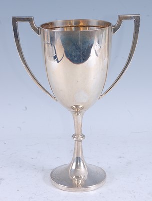 Lot 220 - An early Art Deco silver twin handled pedestal...