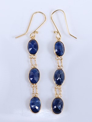 Lot 2193 - A pair of yellow metal sapphire drop earrings,...