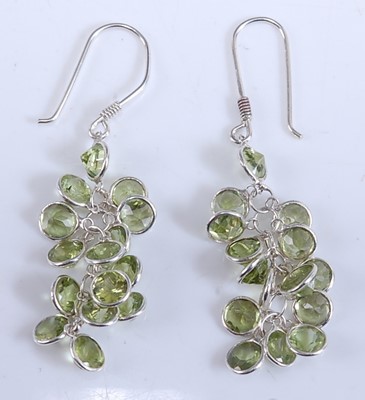 Lot 2509 - A pair of white metal peridot multi-stone...
