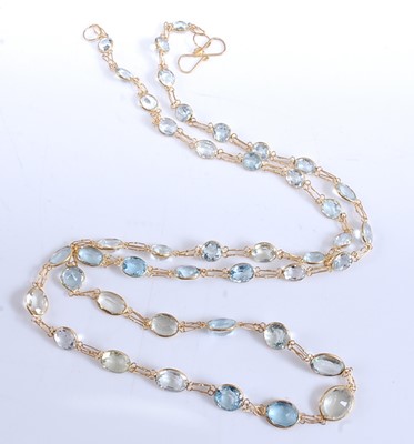 Lot 2510 - A yellow metal aquamarine necklace, featuring...