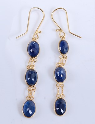 Lot 423 - A pair of yellow metal sapphire drop earrings,...