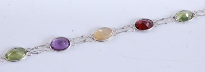 Lot 458 - A white metal multi-stone bracelet, comprising...