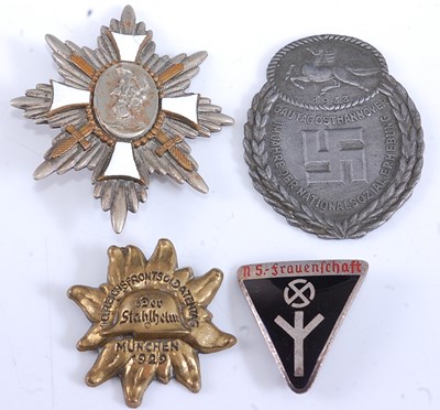 Lot 190 - A collection of four German badges to include...