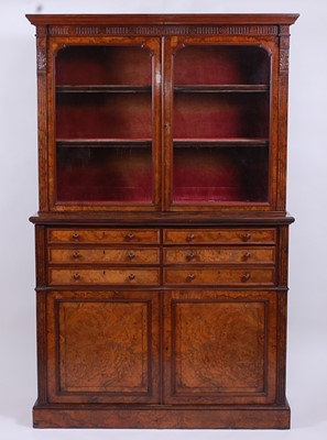 Lot 2521 - A Victorian figured walnut bookcase cabinet in...