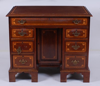 Lot 2467 - A 19th century mahogany and inlaid kneehole...