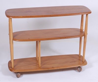 Lot 510 - A 1960s Ercol light elm three-tier bookshelf...