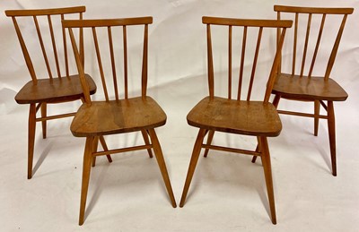 Lot 512 - A set of four 1960s Ercol light elm stickback...
