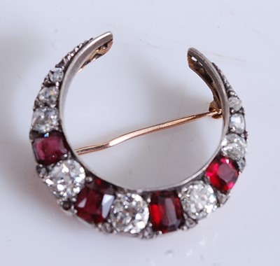 Lot 2201 - A yellow and white metal, diamond and garnet...