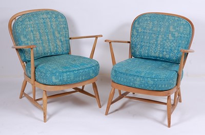 Lot 511 - A pair of Ercol light elm stickback elbow...
