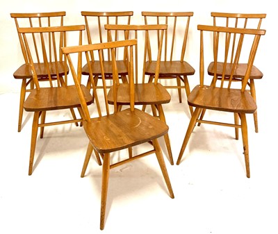 Lot 516 - A set of eight 1960s Ercol light elm stickback...