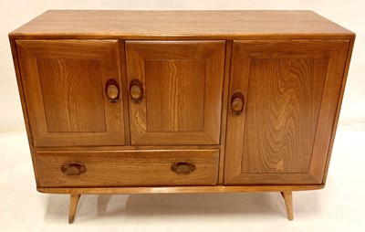 Lot 518 - A 1960s Ercol light elm Windsor sideboard,...