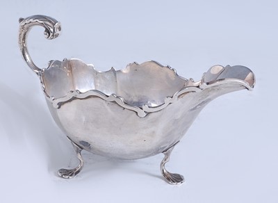 Lot 2147 - A George V silver sauceboat, of slightly lobed...