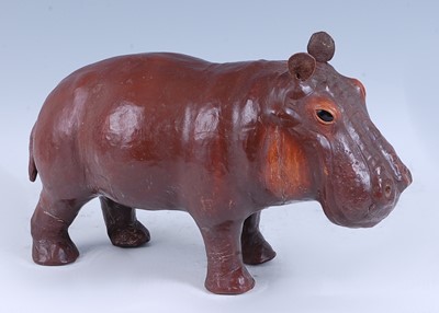 Lot 290 - A small tan leather covered model of a...