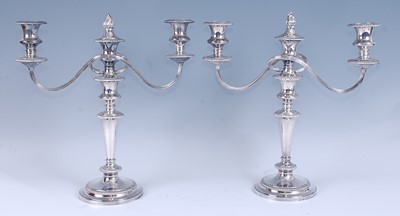 Lot 2152 - A pair of silver plated three-light candelabra...