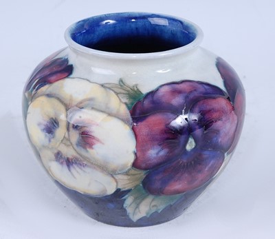 Lot 82 - A Moorcroft Pansy pattern pottery squat vase,...