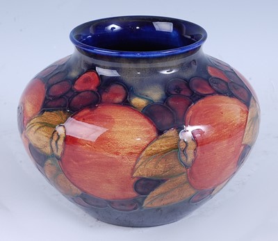 Lot 79 - A Moorcroft Pomegranate pattern pottery squat...
