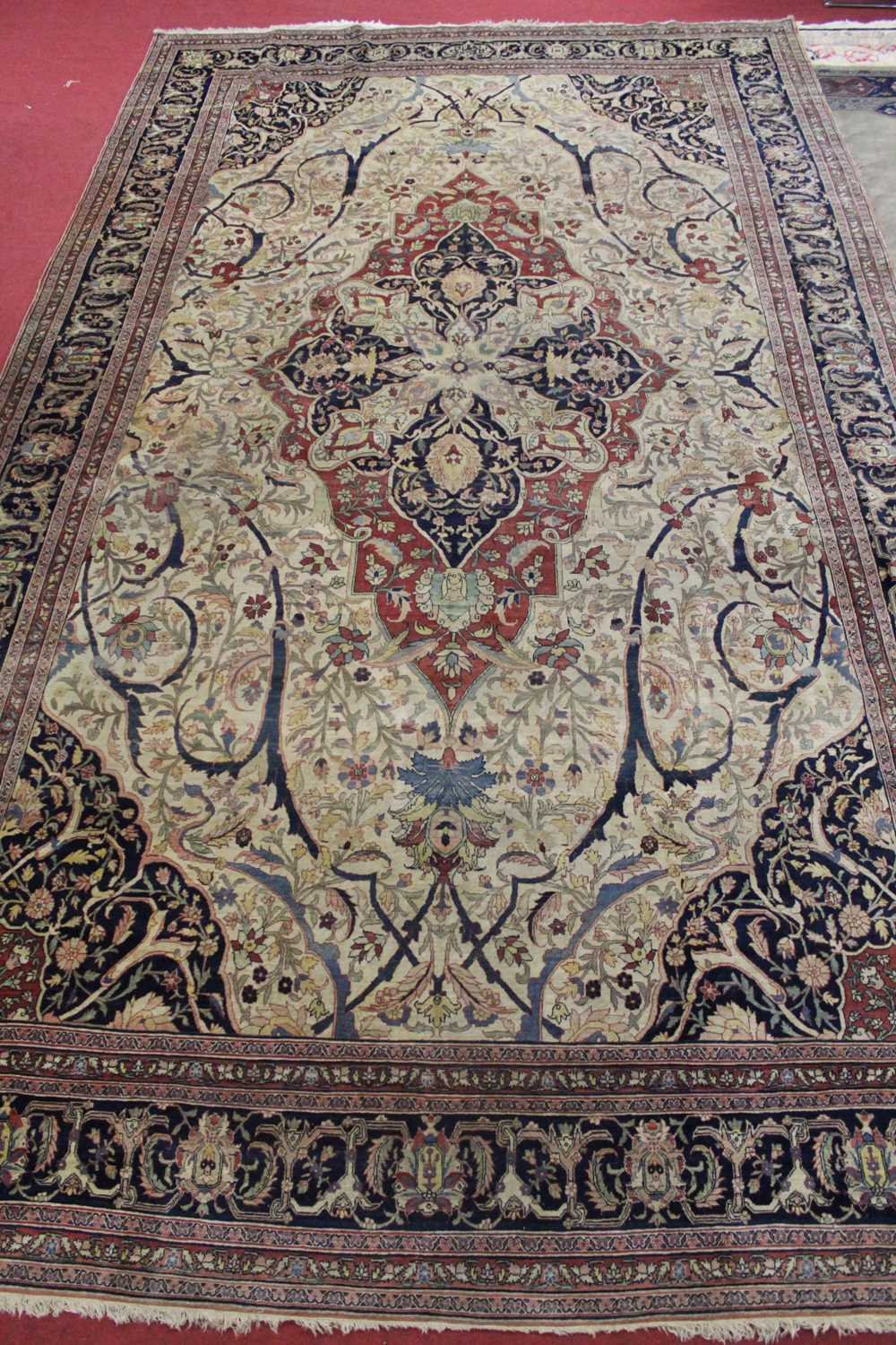 Lot 1380 - A Persian woollen Isfahan carpet, the central...