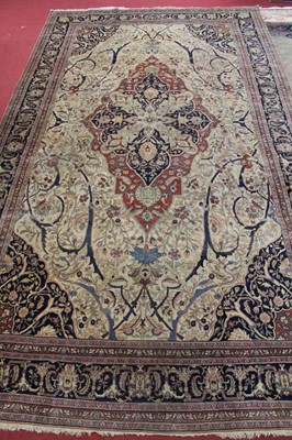 Lot 1380 - A Persian woollen Isfahan carpet, the central...