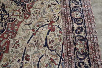 Lot 1380 - A Persian woollen Isfahan carpet, the central...