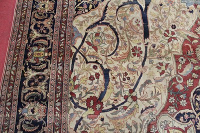 Lot 1380 - A Persian woollen Isfahan carpet, the central...