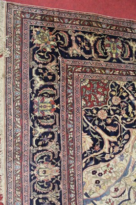 Lot 1380 - A Persian woollen Isfahan carpet, the central...