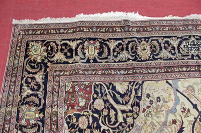 Lot 1380 - A Persian woollen Isfahan carpet, the central...