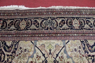 Lot 1380 - A Persian woollen Isfahan carpet, the central...
