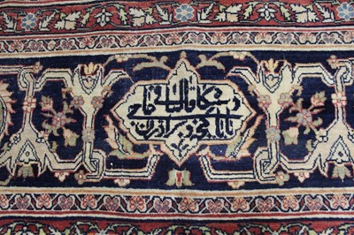 Lot 1380 - A Persian woollen Isfahan carpet, the central...