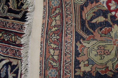 Lot 1380 - A Persian woollen Isfahan carpet, the central...
