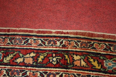 Lot 1380 - A Persian woollen Isfahan carpet, the central...