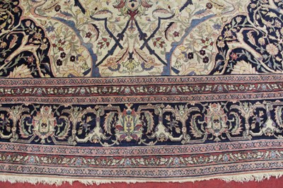 Lot 1380 - A Persian woollen Isfahan carpet, the central...
