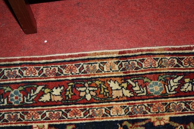 Lot 1380 - A Persian woollen Isfahan carpet, the central...