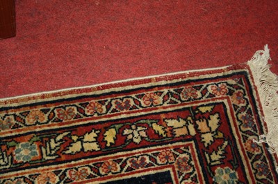Lot 1380 - A Persian woollen Isfahan carpet, the central...