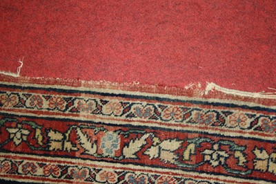 Lot 1380 - A Persian woollen Isfahan carpet, the central...