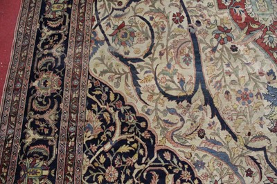 Lot 1380 - A Persian woollen Isfahan carpet, the central...