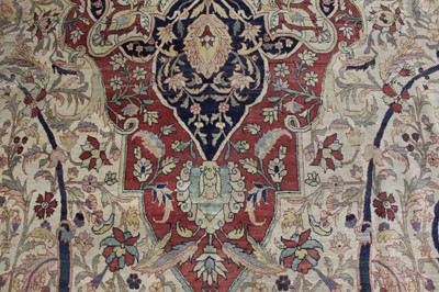 Lot 1380 - A Persian woollen Isfahan carpet, the central...
