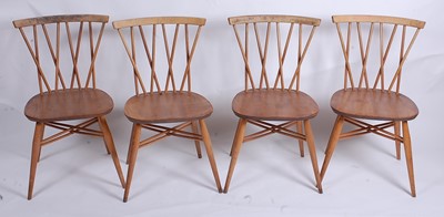 Lot 520 - A set of four 1960s Ercol light elm...