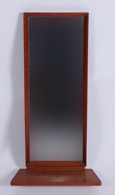 Lot 579 - A small 1960s teak mirrored wall shelf, with...