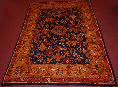 Lot 2451 - An Arts & Crafts Donegal woollen rug, the blue...