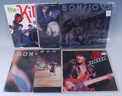 Lot 1038 - A collection of ten 12" singles and LP's to...