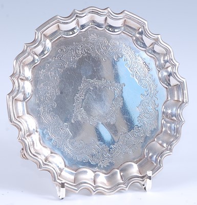 Lot 2140 - An Edwardian silver card waiter, of shaped...