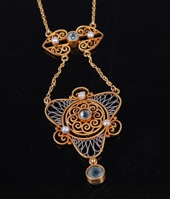 Lot 2163 - A circa 1920 yellow and white metal openwork...