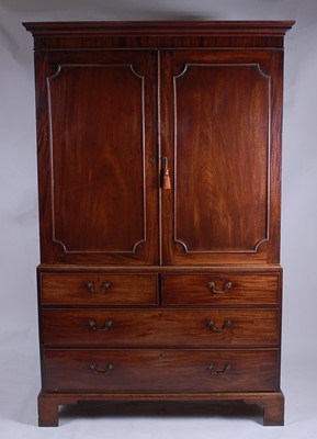 Lot 2516 - A George III mahogany linenpress, having a...