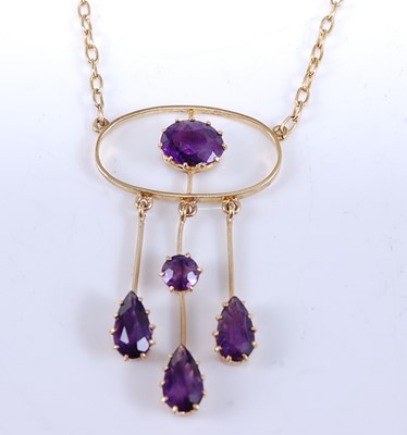 Lot 2533 - A yellow metal amethyst openwork pendant,...