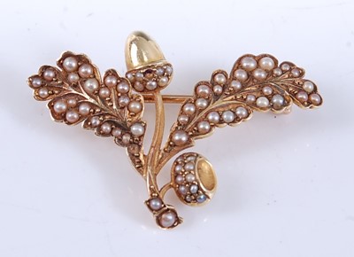 Lot 2523 - A yellow metal acorn and oak leaf brooch, set...