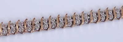 Lot 2542 - A 9ct yellow and white gold two-row diamond...